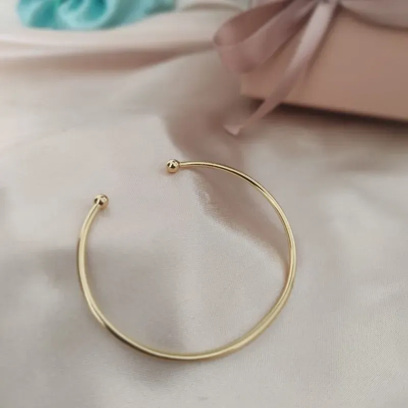 BRACELETE LISO PARTIDO COM ESFERAS NAS PONTAS 1,5MM