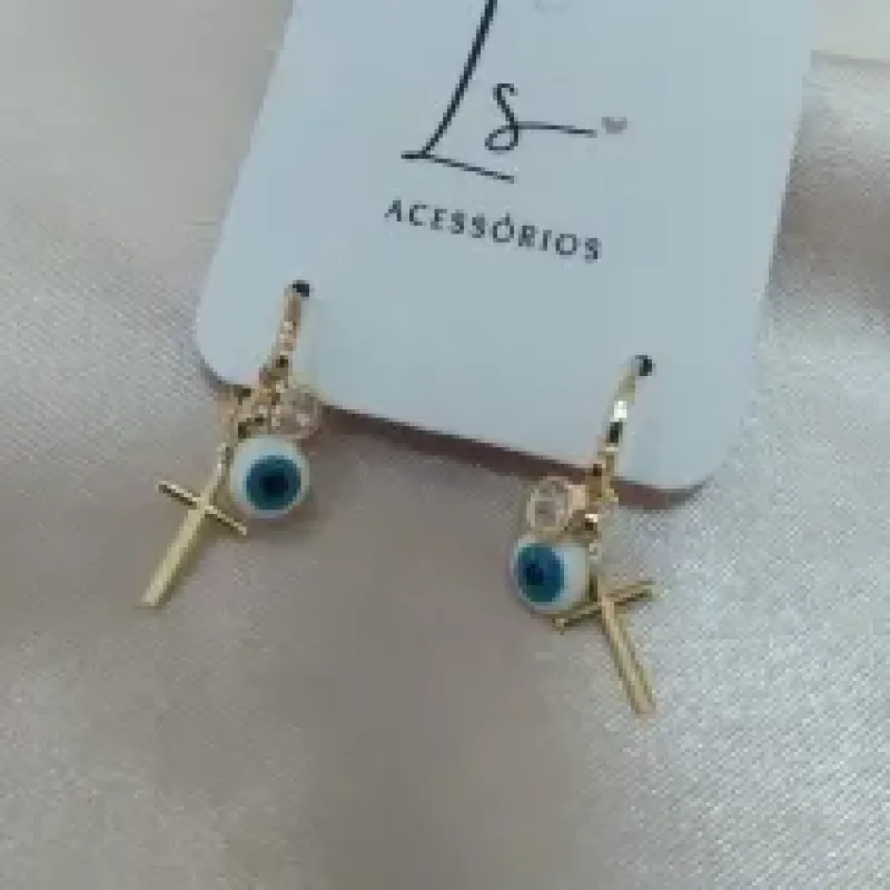 BRINCO ARTICULADOR 3 PINGENTES CRUZ OLHO E PONTO DE LUZ