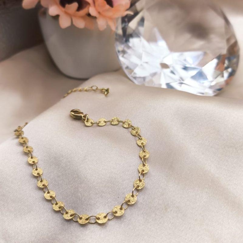 PULSEIRA COM PLASCAS REDONDAS PEQUENAS CRAQUELADAS