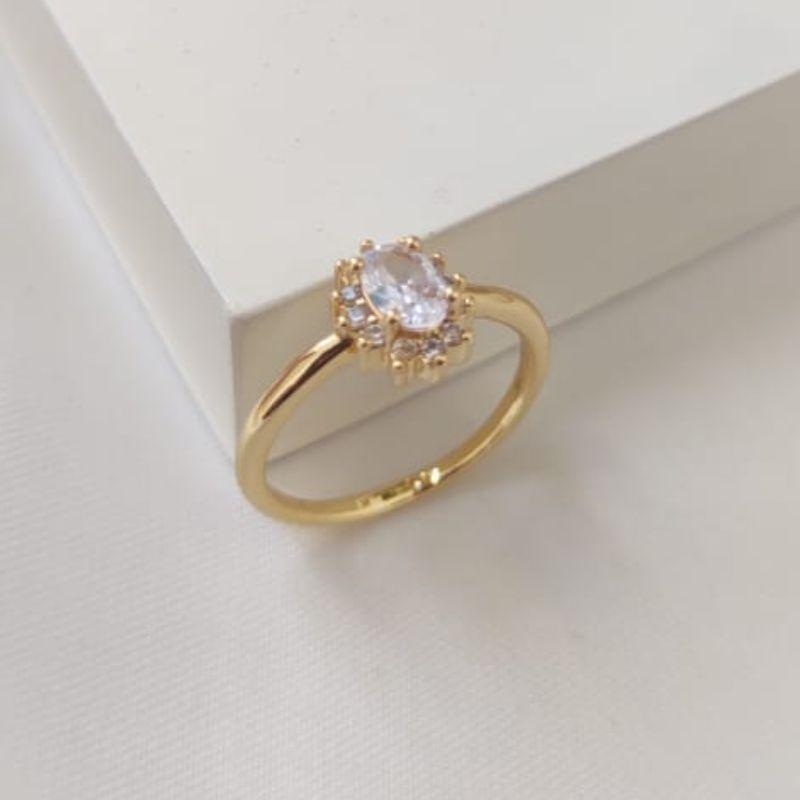 ANEL COM PEDRA OVAL COM MICRO ZIRCONIA AO REDOR