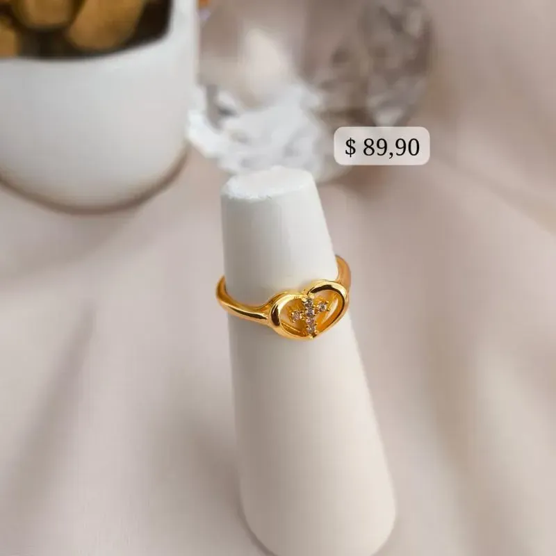 ANEL COM CORAÇÃO E CRUZ NO MEIO E CRAVEJADO EM MICRO ZIRCONIA ANEL COM CORAÇÃO E CRUZ NO MEIO E CRAVEJADO EM MICRO ZIRCONIA