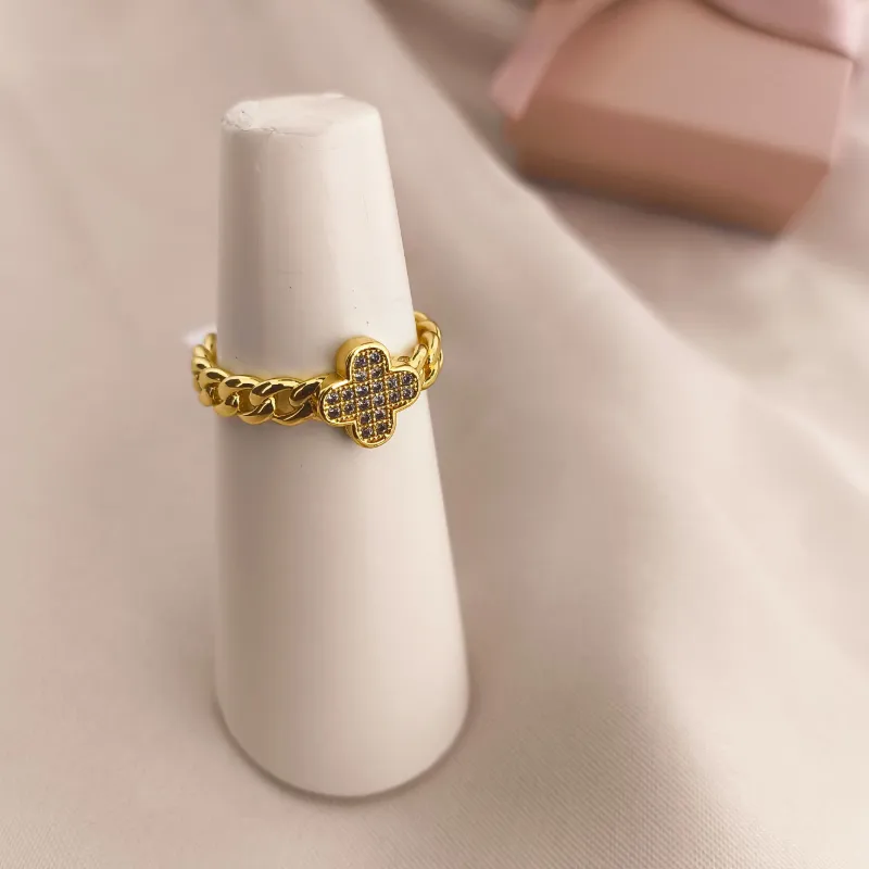 ANEL ESTILO CORRENTE ELO GROUMET E FLOR TREVO CRAVEJADO EM MICRO ZIRCONIA ANEL ESTILO CORRENTE ELO GROUMET E FLOR TREVO CRAVEJADO EM MICRO ZIRCONIA