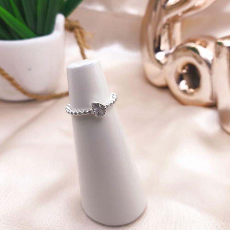 ANEL COM GOTA TORTA DE ZIRCONIA CRAVEJADO EM MICRO ZIRCONIA ARREDONDAS