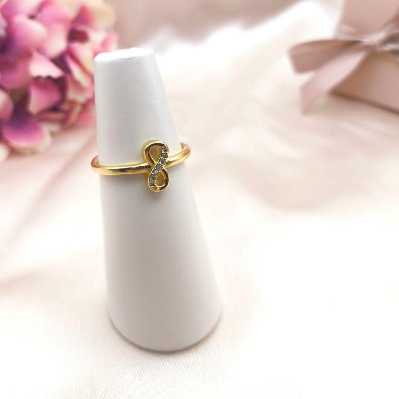 ANEL COM INFINITO NO MEIO LISO E CRAVEJADO EM MICRO ZIRCONIA