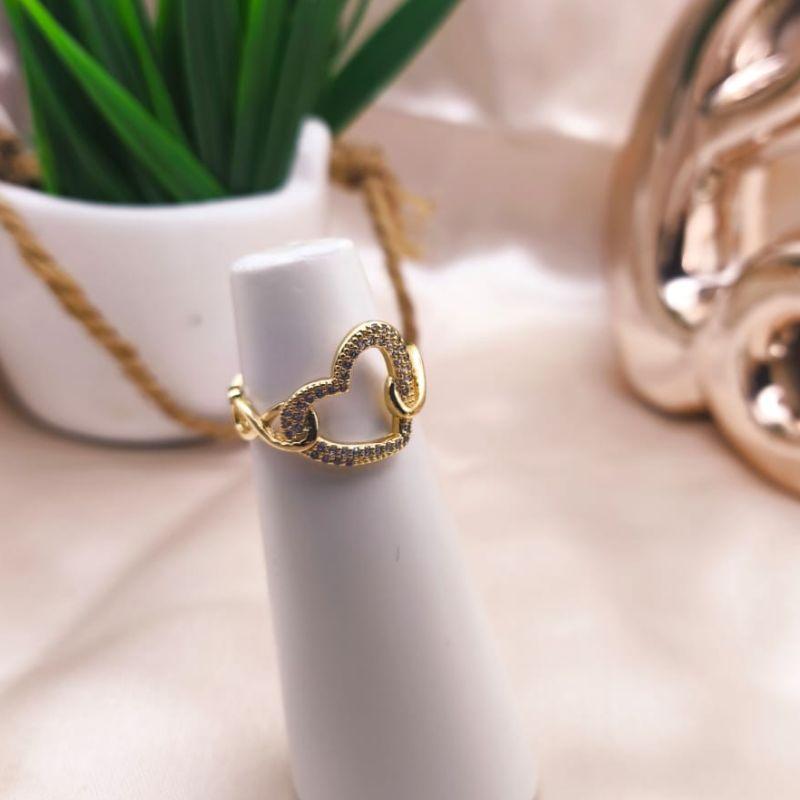 ANEL TOTO EM INFINITO COM CORAÇÃOVAZADO NO MEIO CAVEJADO EM MICRO ZIRCONIA