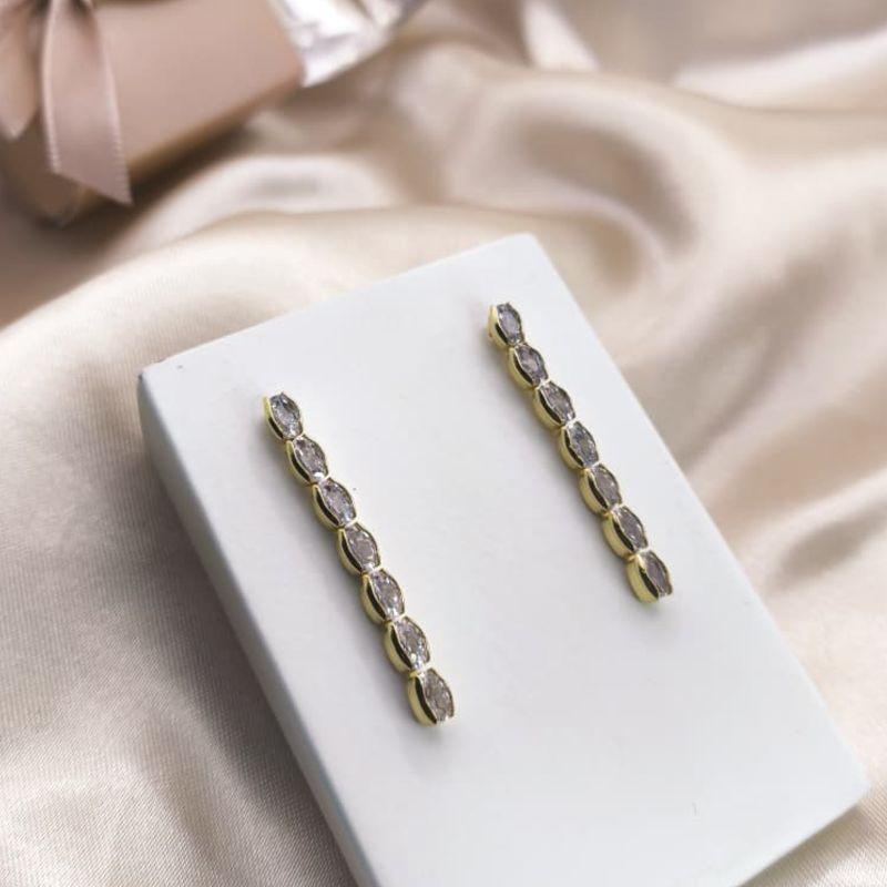 BRINCO NA VERTICAL COM 7 PEDRAS OVAIS DE ZIRCONIA