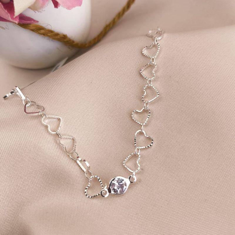 PULSEIRA COM CORAÇÕES CRAQUELADOS E PEDRA DE ZIRCONIA NO MEIO