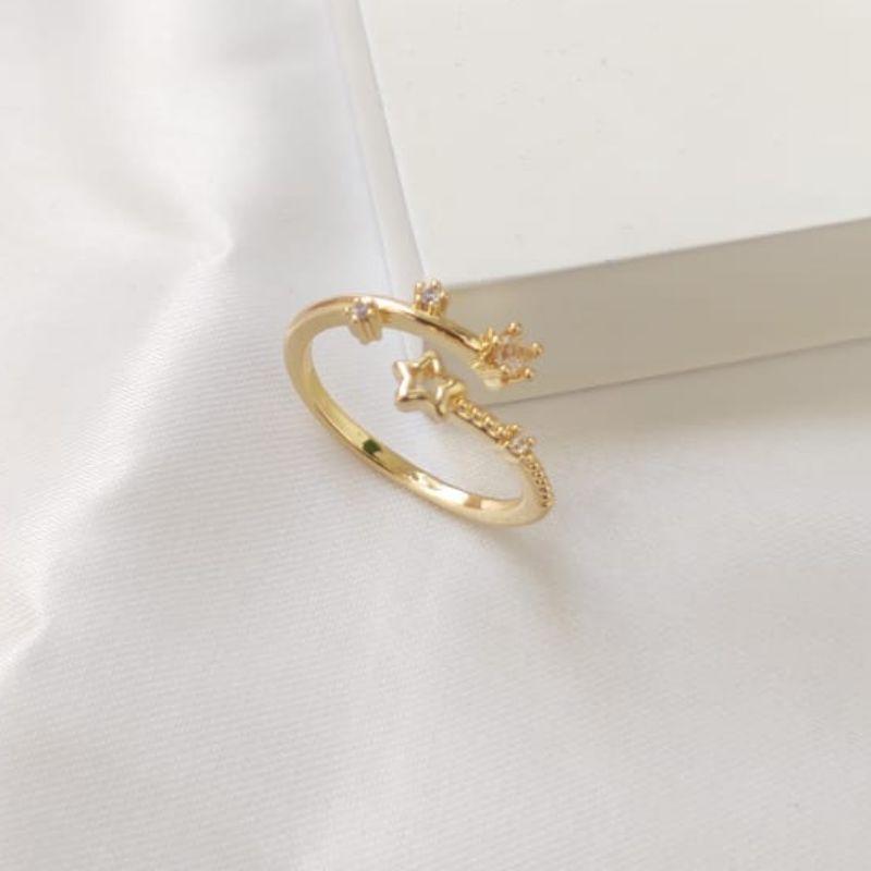 ANEL REGULAVEL COM ESTRELA VAZADA E PONTO DE LUZ