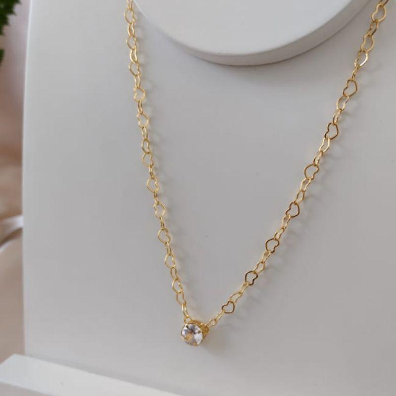 CHOKER CORAÇÃO ENTRELAÇADOS COM PINGENTE PONTO DE LUZ