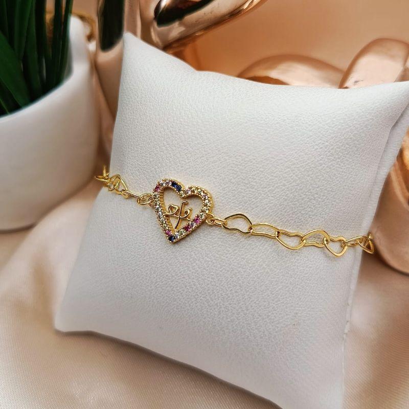PULSEIRA COM CORAÇÃO CRAVEJADO EM MICRO ZIRCONIA COLORIDAS E NOME FE