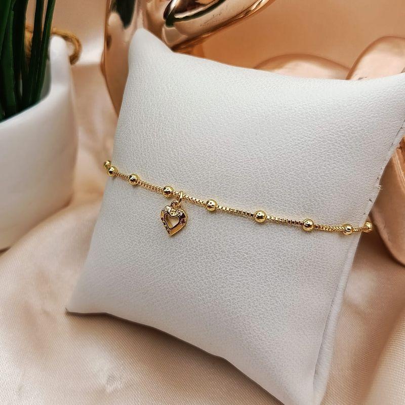PULSEIRA COM MINI ESFERAS E CORAÇÃO PENDURADO VAZADO COM PEDRAS DE ZIRCONIA COLORIDAS