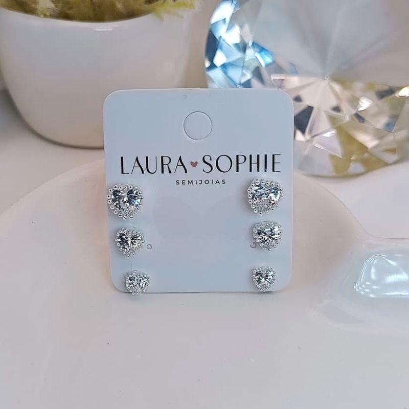 TRIO DE CORAÇÃO COM UMA PEDRA DE ZIRCONIA NO MEIO E BORDA DE BOLINHAS
