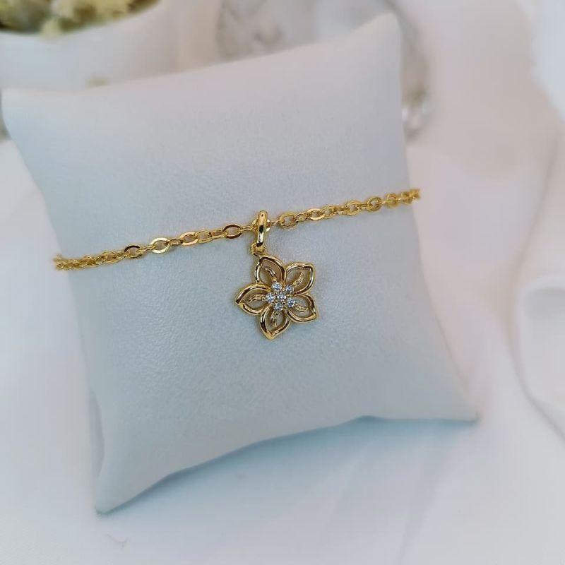PULSEIRA COM PINGENTE DE FLOR COM MICRO ZIRCONIA CENTRAIS