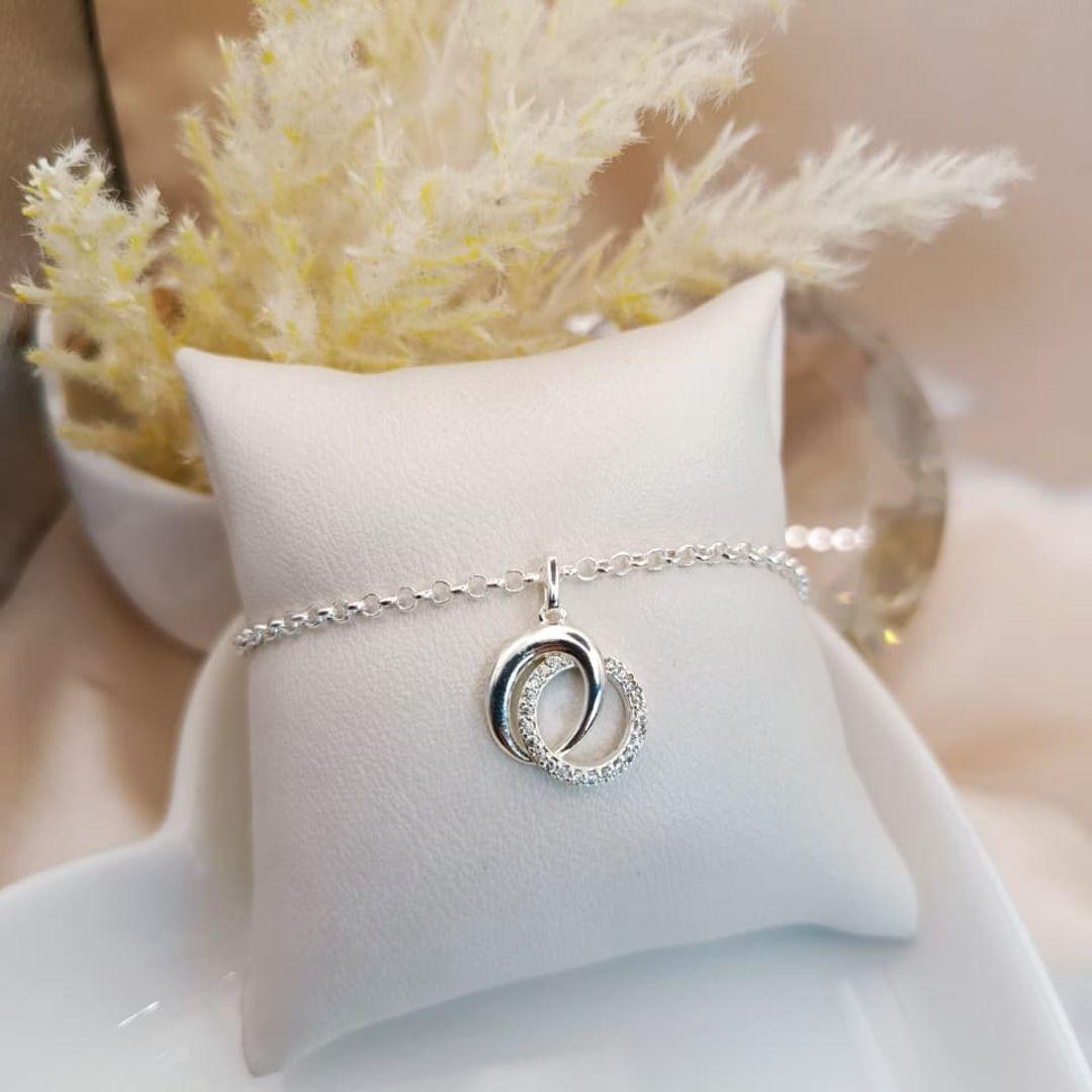 PULSRIA COM 2 CIRCULOS LISO E CRAVEJADO EM MICRO ZIRCONIA